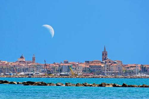 alghero landscape under a huge moon