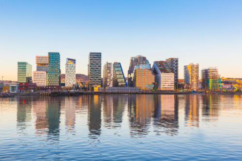 Modern buildings in Oslo with their reflection into the water