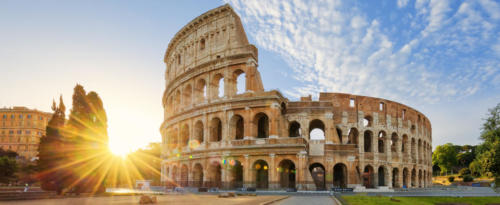 Colosseum in Rome and morning sun, Italy